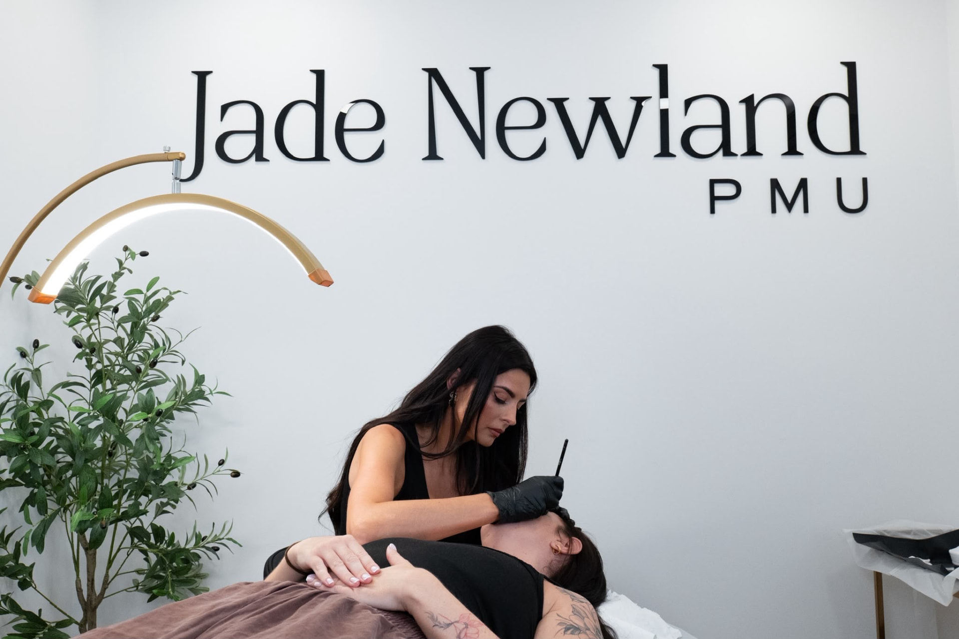 Jade working on a client in the Jade Newland PMU studio